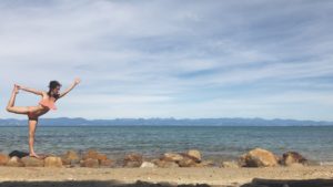 Abel Tasman New Zealand dancer asana pose on beach